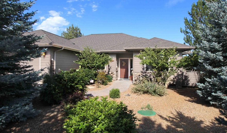 Must see this beautiful open concept home with propane fireplace, large dining area, kitchen, breakfast area & office. This 2321 square foot home is on the Challenge golf course near the second tee. Relax on your back patio under your powered awning. The Primary Bed/Bath Suite is separated from the other 2 bedrooms that feature their own Jack & Jill bath. Enjoy huge primary bath's large glass shower, soaking tub & walk in closet.  Kitchen boasts a granite island, propane gas range & lots of cabinets. The spacious breakfast area & living room picture windows provide sweeping golf course views. Utility includes Washer & Dryer & utility sink. Walled single car part of 3 car garage allows separation for shop. 30 amp hookup outside; tough and durable concrete fiber siding. Heating & cooling is provided by energy saving ductless heat pump. This is a must see home in the beautiful Ridges at Eagle Crest that offers golf, swimming, playground and quiet living only minutes from city.