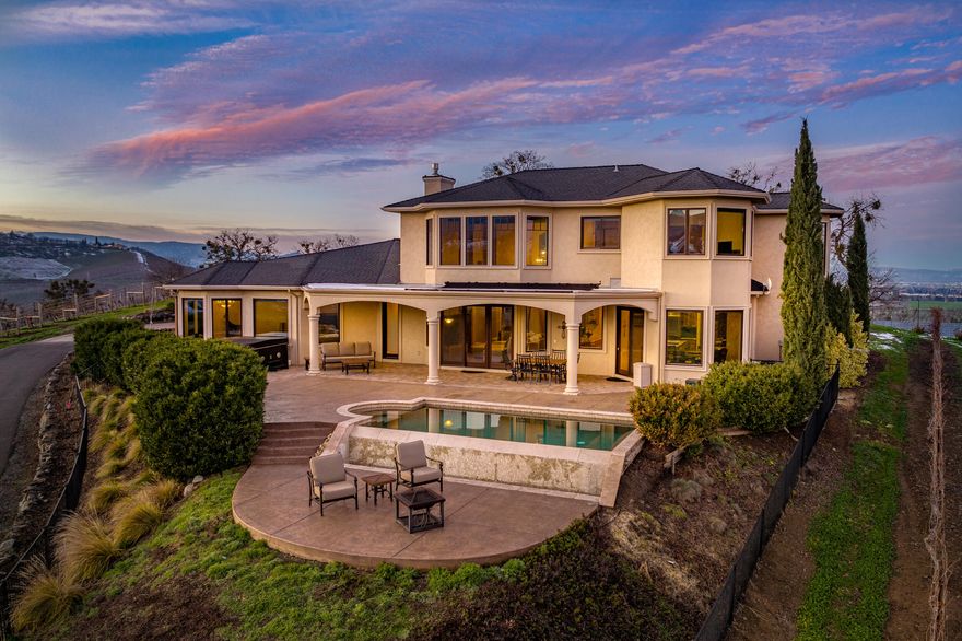 Welcome to Carpenter Hill Vineyard Estate. Perfectly placed on top of the 17 acres is the custom estate home by Pagnini. With a Tuscan design, this 3,429SF home boasts stunning details w/an expansive master suite, 2 guest bedrooms & bathrooms, wine cellar, office, laundry room, & over 20' ceilings in the living room w/gas fireplace. Large outdoor entertaining areas w/infinity pool & hot tub. The detached 2-car garage includes a guest suite w/full bathroom. The 1,869SF farm dwelling was built in 1917 & includes a 1,296SF 3-car garage. The vineyard encompasses 13.21 net acres, w/Syrah, Petite Syrah, Merlot, & Mourvedre. There are also 15.9 acres of TID & a 1,200 SF shop. Fully paved driveway to main home w/private gated entry. Carpenter Hill Vineyard Estate is a one-of-a-kind opportunity that combines dramatic views, stunning elegance, convenience to town, & resembles the very essence of Southern Oregon. 27 GPM well (tested 2022) + 2,000 gallon holding tank. More info available.