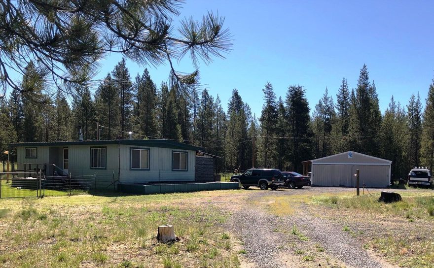 This cozy home sits on 1.4-acre parcel that is nicely cleared and has fencing for animals.  The exterior has been painted in the last few years and roof has been upgraded to a metal roof.  Septic tank was replaced with a cement tank, also has a 2-car metal garage with gravel floor. 2 beds, 1 bath, living room, dining area with built in's, kitchen 2 pantries and laundry.  Back porch is covered with each end enclosed.  Home has been a rental and the interior does need some TLC.  But cute floor plan and in an area close to all central Oregon has to offer.  This property probably will not be financeable. Would continue as a great rental, or a nice home for you and yours.  Not many in this price range, call for your private showing.  Being sold as is.