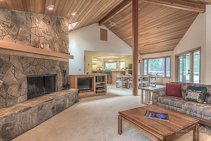 Tucked at the end of a quiet cul-de-sac, 10 Golden Eagle is nestled next to the Sun & Deschutes rivers. Easy access to biking/walking paths along the river. The main level boasts a large Master Suite, oversized kitchen, comfortable Great Room, half-bath, and a wonderful wrap-around deck with filtered river and mountain views. The lower level has two bedrooms, a bath, family/bonus room, and a hot tub. This home is perfect for a full time resident or a family vacation get-away. Start making Sunriver memories