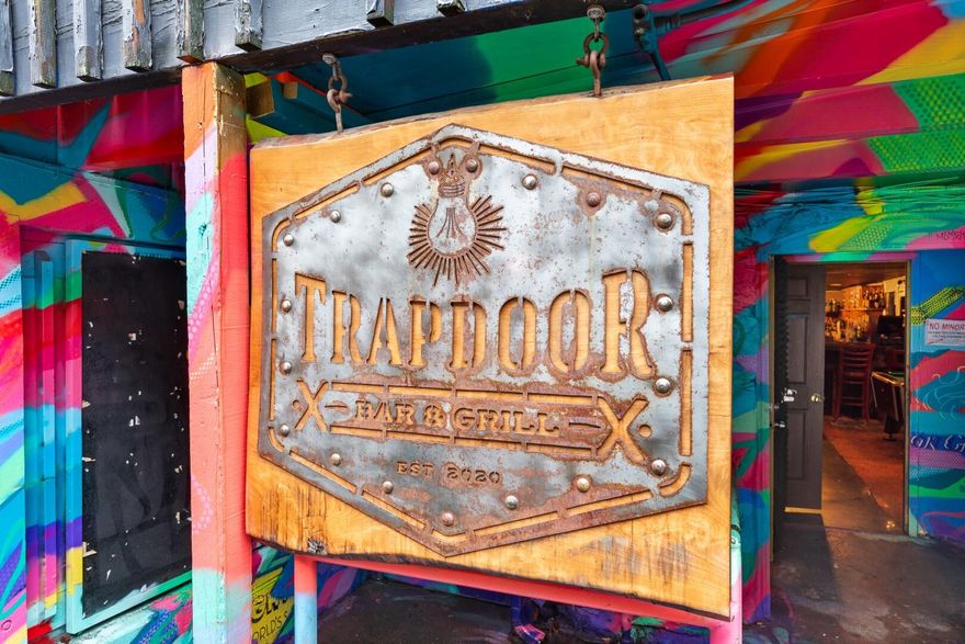 Location, location, location! Ever wanted to operate a bar and grill in the heart of Downtown Ashland? If so, this is the one for you! Established in 2020, Trapdoor Bar and Grill offers a nightclub ambiance with a versatile menu in both food and drinks, dancing, and gaming (pool table & arcade games included). Both the bar and kitchen are extremely spacious, and this property has a fantastic floor plan that would allow any operator to thrive! All liquor/food inventory, dining equipment, and appliances are included within the sale. No real estate included. This opportunity won't last long, so contact your agent today for a personal tour, before it's too late! Appt only.