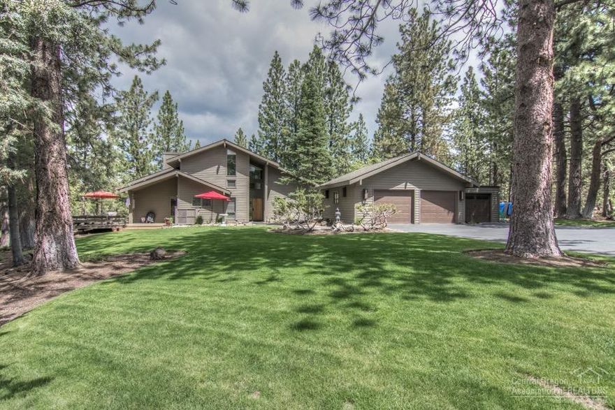 Secluded hill top setting in Woodside Ranch! Large Ponderosa pines surround this quality home sitting on 2.5 acres yet close to town! The minute you enter this gracious home you are surrounded by the warmth of cedar accents, wood beams and a rock fireplace. Brand new remodeled kitchen is a cook's dream with upgraded SS appliances. Home is light & bright with many large windows bringing nature inside. It boasts an expansive wrap-around deck for entertaining, park-like landscaping w/sprinklers & 3 car garage.