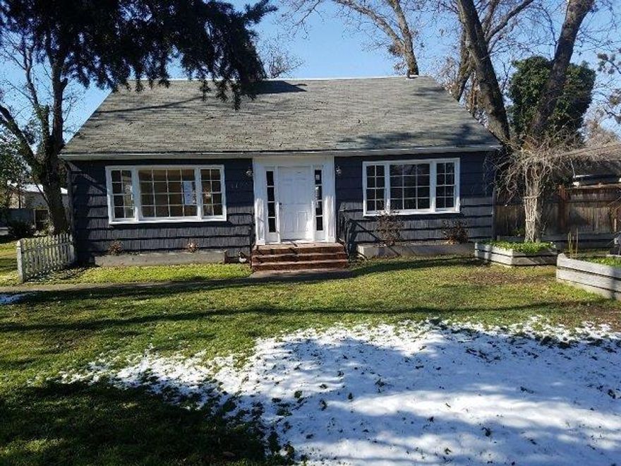 1951 Cape Cod In Medford's Oakdale Historic District. Majestic Oak and Blue Spruce trees adorn this .29 corner lot. Hardwood flooring throughout. Custom slate tiling from foyer to kitchen, breathtaking stone-laden fireplace in the living room, upgraded granite countertops, oak cabinets and modern appliances in kitchen. Detached garage converted into a 300 plus sq ft bonus area which could be used as an office or guest quarters.