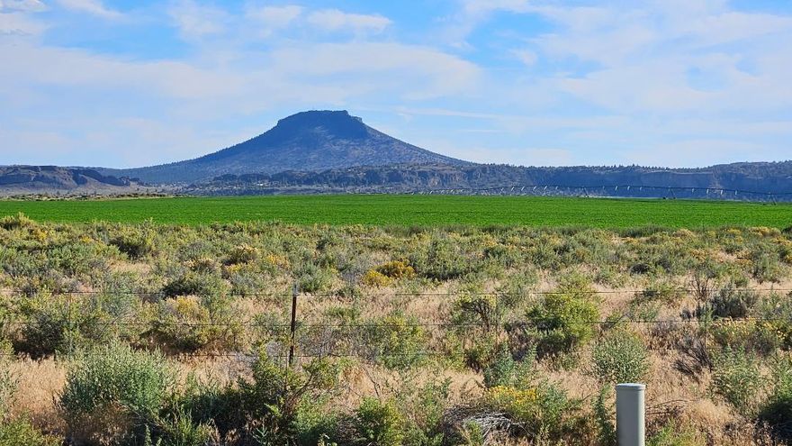Beautiful Homesite on Paved Road with beautiful views of Alfalfa fields and Tablerock Mountain along with panoramic views of other Mountain ranges. Yes, with a Conditional Use permit you can make this your homesite. Electricity conveniently at the road edge it would make a great place for your home. Come of enjoy the starlite nights and all the activities available for the whole family to enjoy.