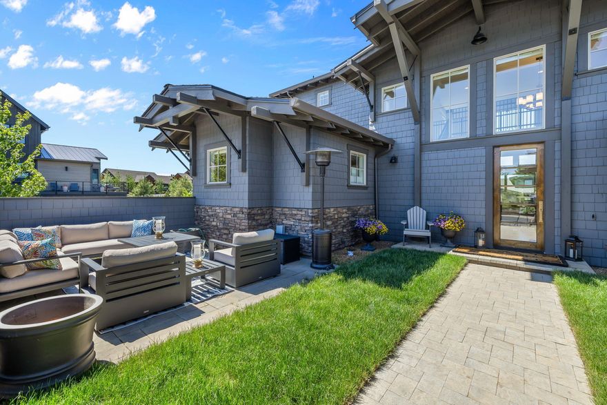 Stunning Cascade Mountain view home perfectly blends NW contemporary design with nature's splendor. Bathed in natural light, the open floorplan features soaring ceilings & expansive windows framing breathtaking views. The light-filled great room impresses w/ stone fireplace & acacia wood flooring providing a warm & an inviting atmosphere. Award-winning kitchen is a culinary delight, with large granite island w/ prep sink, quartz counters, top-of-the-line appliances, & spacious walk-in pantry. Dining area opens seamlessly to paver patio, perfect for entertaining or enjoying serene sunsets. Patio is also accessible from luxurious main-level primary suite, offering a tranquil haven w/spa-worthy bath featuring soaking tub, make-up vanity, walk-in shower, dual sinks & generous walk-in closet. Upstairs, two en-suite guest rooms are connected by a sky bridge, each featuring private balconies w/ sweeping mountain views. Fully enclosed courtyard provides for outdoor relaxation & entertaining.