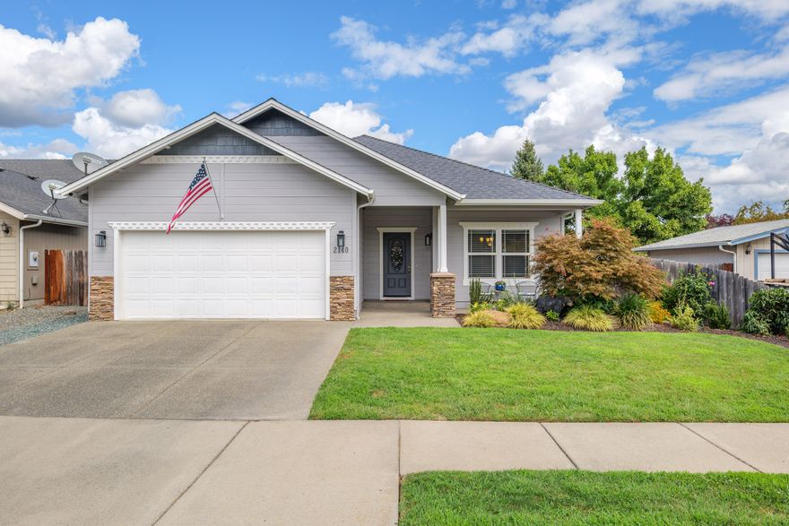 Paradise is Southwest Grants Pass! You'll feel right at home in this well cared for 1668 square foot, three bedroom, two bath home built in 2007! Welcoming covered front patio leads to a spacious living area featuring vaulted ceilings & a freshly updated kitchen accented by eating bar, granite counters, large pantry, stainless steel appliances & dining a dining room perfect for every occasion. Just off the living room is a large sliding door leading to a spacious back patio & low-maintenance yard complete with artificial grass! Inside, the three large bedrooms includes a spacious primary complete with a large walk-in closet & private ensuite bath with double-sinks, Granite counter tops & walk-in shower! Additional features include a laundry room with storage cabinets, hardwood flooring throughout, plus a two-car garage with storage options. All conveniently located just minutes from District 7 schools, parks, shopping & more! Call today to make this house your home!