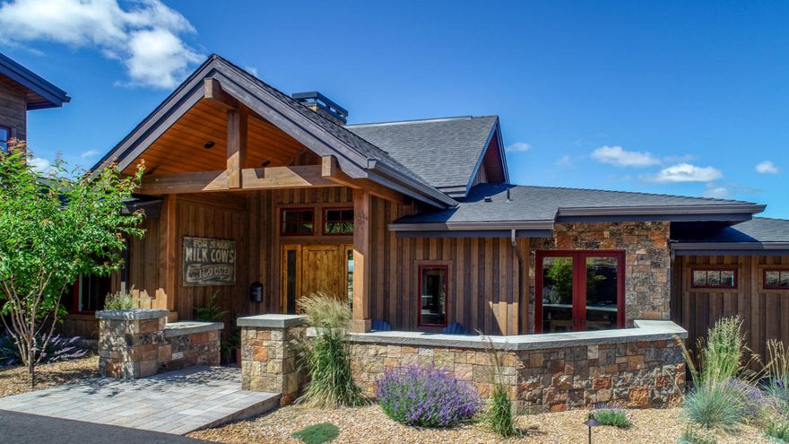 Phenomenal home located at the top of the ranch. Panoramic Cascade Mountain views and high desert sage surround this gorgeous custom home. As  you enter the home, you are greeted by an expansive great room featuring large windows, hardwood flooring, wood built-ins, vaulted ceilings, and a double sided free standing fireplace. Enjoy spacious living, dining and gourmet indoor cooking. The chef's kitchen includes top of the line appliances, an island, beautiful cabinetry and a farmhouse sink.  The utility room doubles as a mud room and offers plenty of storage as well as tile floors and a utility sink. The Master bedroom has sweeping views of the mountains, access to the deck, a standalone tub, two beautiful vanities and a large walk in closet. Another ensuite bedroom and large office/den round out the main level. Upstairs and through a private entrance is a casita with an open area studio concept including a bedroom, sitting area, kitchen, bathroom and private patio. The vaulted deck off