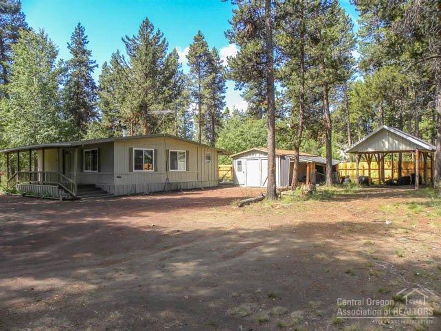 1 Acre private corner lot on well-maintained road with easy access to all things outdoors. Home has Fresh paint, vinyl windows, metal roof, covered porch, newer wood stove and electric forced air. All appliances included to help make this a move in ready, affordable home for first time buyer or investor. Exterior features include fenced back yard, single car garage plus carport RV, or other recreational toys.