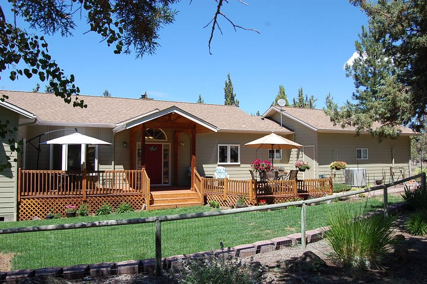 If you are looking for peace, quiet, and privacy, you have found it!  Wonderfully convenient to the town of Sisters, OR yet only 20 apprx miles to Redmond or Bend.  Come see all the improvements and tender loving care given this one-owner home.  And, the outbuilding is almost as big as the home 48x32 apprx=1536 sq ft w/easy to convert (13x23) workshop to mother-in-law appt. (incl pellet stove and half bath).  In addtn to shop, there's an attached insulated 2 car gar w/2 man doors and mud access to laundry room.  Huge newly stained cedar decks front and rear, lovely  landscaped fenced yard w/drips for flowers, vaulted ceilings thru-out, cozy Quadra-fire woodstove plus convenience of forced air heat and AC.  French doors from primary suite, dining and living rooms and wonderful walls of windows to the view of magnificent Mount Jefferson!  Don't delay, call for your showing today!