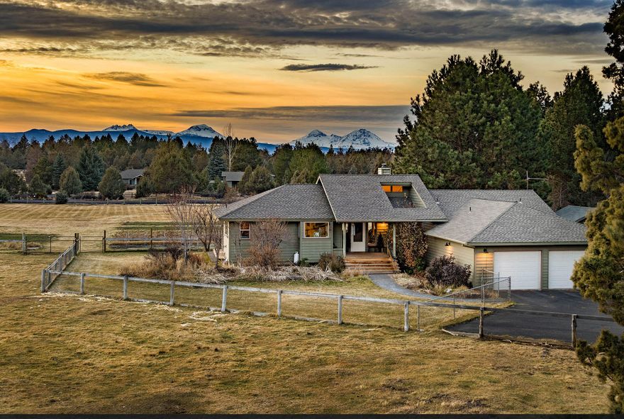 A lovingly cultivated flower farm ready to call home, this 5 acre countryside property lies just minutes from town yet offers premium views, setting, and a sense of serenity. Complete with a 1,200 sqft barn, fenced pasture, additional detached garage, 2 commercial sized greenhouses, extensive raised beds with drip irrigation, fruit orchard, and 2 story farmhouse with character to spare. This property includes 4 acres of Swalley irrigation with extensive underground system, pond & pumphouse. Inside, a stately covered entry gives way to a sunny living space with vaulted ceiling and Jotul woodstove. In the kitchen, find a cozy breakfast booth, cherry cabinets, dual level island, hardwood floors, and SS appliances. Primary suite features a large skylight to enjoy while soaking. The 2nd bedroom & full bath are also on the main level, as well as a music/playroom/office space. Downstairs, find a carpeted 3rd bedroom w/built-in bookshelves. Enjoy sunsets from this back porch for years to come!