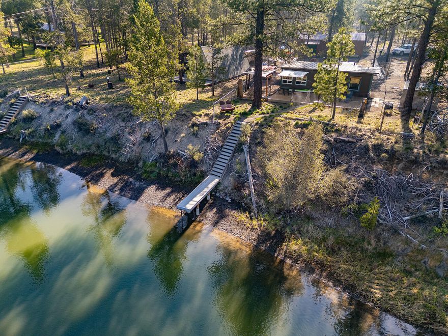 WATER FRONT ELEGANCE! Have you dreamed of waking up with the river right outside your door and enjoying your morning coffee/tea on your own PRIVATE DOCK? This is your dream come true. Low maintenance 584 sq ft studio cottage with a bathroom and kitchen. Perfect place to have plenty of time to enjoy swimming, paddling, kayaking or any of the other great activities that are at your avail here in Central Oregon. Ski and snowboarding enthusiast, hiking and biking enthusiast, there are so many outdoor activities available to live that Great Life that so many dream of. A home on the river at this price is a chance in a lifetime in my opinion. Be the FIRST one to schedule your private showing. Call your favorite agent NOW!