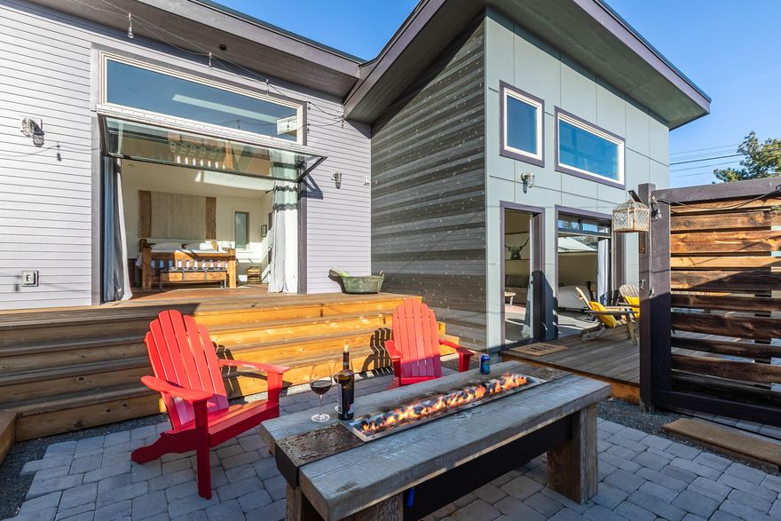 Enjoy the fun and festive Bend lifestyle in this updated downtown Bend bungalow with attached studio apartment. Just a short stroll or bike ride to breweries, restaurants, the Deschutes river and more, this lively updated home is perfect for entertaining. The attached studio with full kitchen offers flexibility as a rental unit or home office. When you walk into the home you are drawn to the light from the large roll up window. This complex addition of the roll up windows along the rear facade opens the home and studio to decks, fire pit and summer enjoyment. With a mix of familiar and extraordinary detailing the family kitchen with loft becomes the hub of the home through all 4 seasons. This enviable location makes it easy to call Bend home.