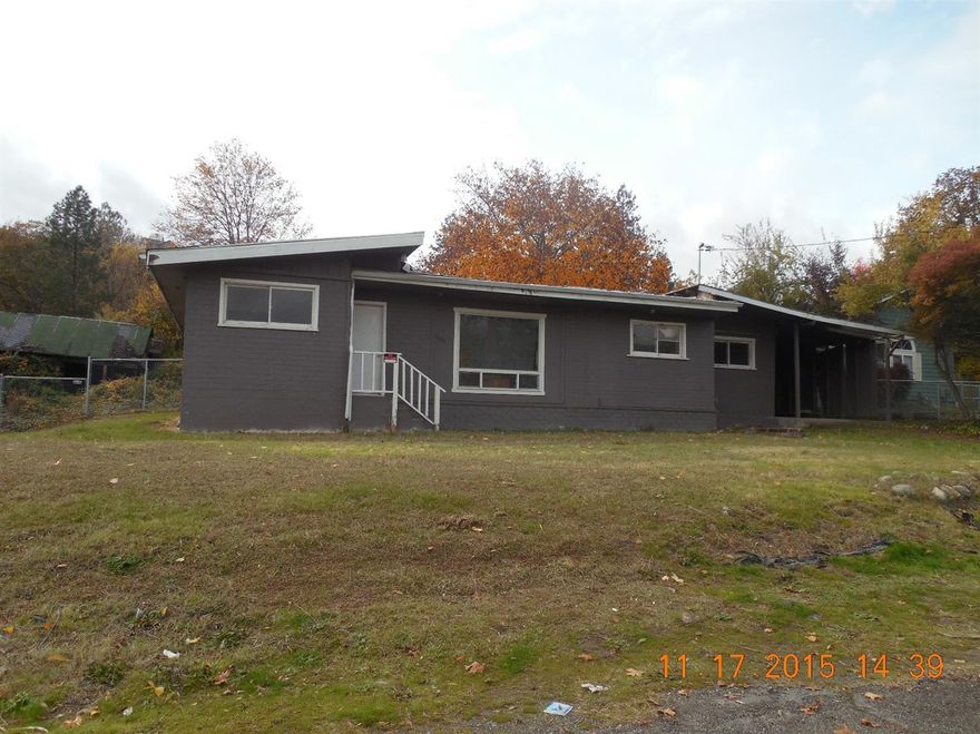 Opportunity knocks! Situated in Northwest Grants Pass, this three bedroom home has so much to offer! With a little TLC, this fixer will be brought back to it's original glory. The home boasts a spacious living room and family room. The large backyard is fenced. The home is fixer and will not finance. The kitchen has been removed, the roof leaks, and the floor coverings have been removed. Listing agent is related to selling company's manager.