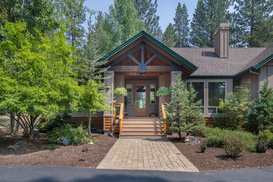 Situated on a spacious 4-acre plot ideally positioned with National Forest on 2 sides. Possible owner terms with 1/2 down, 4% for 4 years, interest only.  The front porch and entryway lead into a Great Room featuring vaulted ceilings and a wood-burning fireplace. An open floor plan seamlessly connects the dining area and kitchen, where new stainless-steel appliances and a roomy pantry make it a hub for gourmet meal creation. Large windows bathe the interior in natural light. The back paver patio beckons you to enjoy the surrounding wilderness or gaze at the night sky while unwinding in the hot tub. The primary bedroom boasts a walk-in closet and ensuite bath with a dual vanity. Two guest bedrooms share a full bath. An upstairs family room with a half bath offers versatility, whether as a media room, office, or game room. The highlight is a spacious 4-car garage that can accommodate vehicles, boats, motorcycles, and still leave space for seasonal decorations.