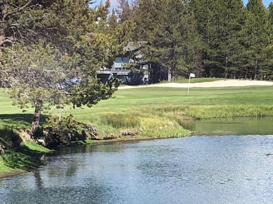 Location, location, location! Situated on the 1st and 2nd fairway of Woodlands Golf Course 5 Hickory lane is a highly coveted property.  Outdoor living at its finest with a large back deck facing the pond and golf course, as well as, featuring a dog run that has been approved by HOA. Spacious great room with vaulted ceiling and wood burning (gas pumped) fireplace adjoins dining and kitchen area. 2 bedroom suites one on main living area. Upstairs suite features sitting area that looks over golf course and pond. This suite adjoins guest bedroom with Jack/Jill pocket door in bathroom. Guest bedroom has stairway leading up to large loft area that could be used for bunk beds, games, crafts or office with amazing view of golf course and pond out of upper window. Garage features one deep bay for extra storage. Spacious storage area added to side of garage.  Metal roofing installed in 2008. This location is close to the North pool, tennis courts, Woodland Golf Course Pro shop & Grill.