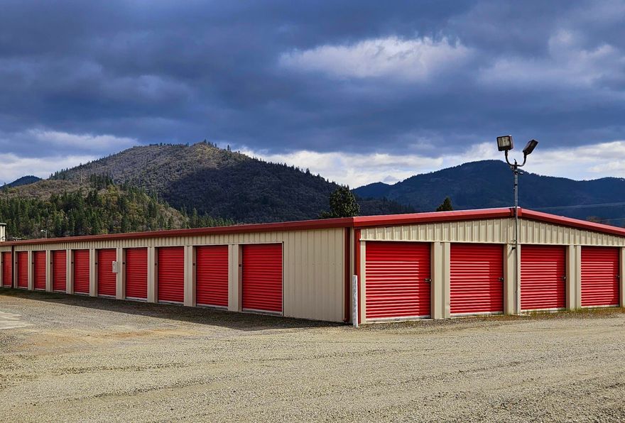 ***Self Storage Investor Alert*** 1st time on the market! Applegate Affordable Storage boasts a great operational and rental history, making this an exceptional investment opportunity! Located on 3 level acres, built 2009 - 2012, there's 134 units, 20,050 SF of leasable space, comprising 4 separate steel buildings, a manager's residence and a separate office. There are an additional 20 large spaces of outdoor R V storage. Some of the buildings are insulated and are slab supported with ETO roll-up doors. Management occupies a1999 3bd/2ba Skyliner manufactured home. Seller says lots of room for expansion. This facility serves the greater Grants Pass and Applegate Valley.