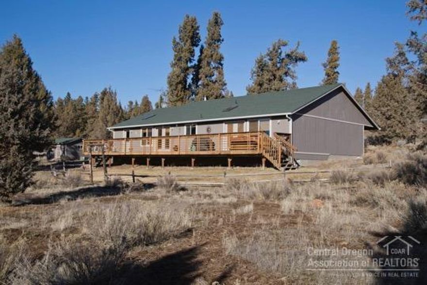 Beautiful single level home sitting on 36+ acres. Only minutes from downtown Sisters, but feels like you're all alone in this pristine wilderness. Mountain views, borders public land, three outbuildings, and has a modest yard with irrigation. Open floor plan, sky lights, wood stove, huge deck and hot tub. This is home!