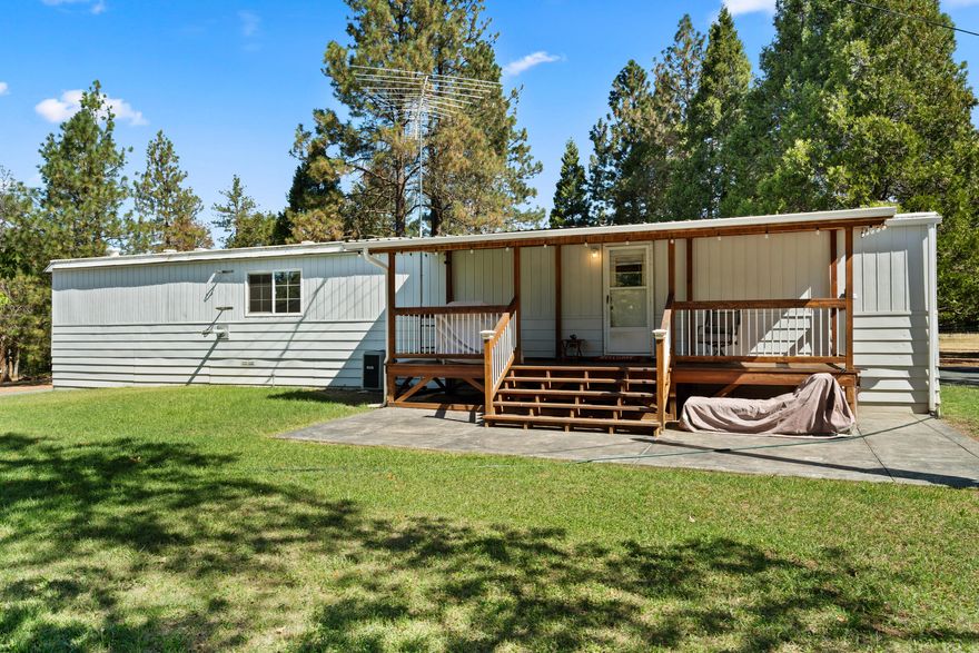 Tranquil 1.78-acre property along Jump Off Joe Creek with 312 ft of water frontage. The 932 sq. ft. 1979 Marlette manufactured home offers 2 beds, 1 remodeled bath, new 2024 Lopi pellet stove, laminate flooring, updated windows, and roof. Includes stainless appliances and Mitsubishi heat/AC. Zoned Rural/Commercial, ideal for a home-based business with a 36x40 insulated shop, roll-up doors, storage room, and sink. Features redwood decks, concrete patio, fenced garden, greenhouse, and sprinklers. Perfect for peaceful living and entrepreneurial dreams.