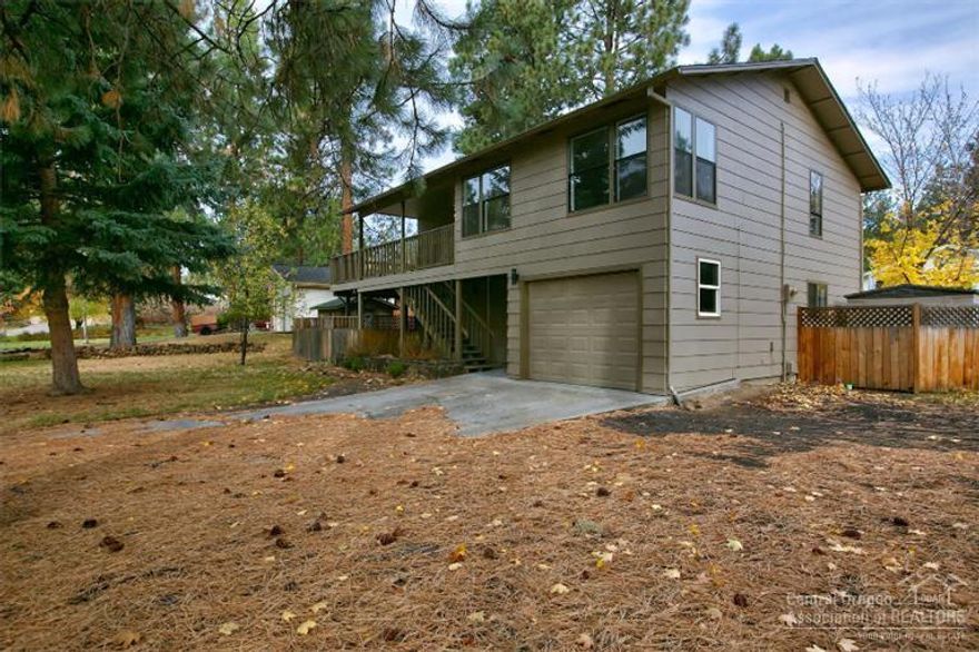 Unique reverse living floor plan on a large .33 acre lot with large spacious living area! Come home to this beautifully renovated 2200 sq ft home that boasts 3 bedrooms, 2 baths, new paint inside and out, new flooring, stainless steel appliances and fixtures. This home has an amazing wrap around deck to entertain company and enjoy summer nights here in Central Oregon! Plenty of room for RV parking and all of your toys! Perfect location! Come see this home today!