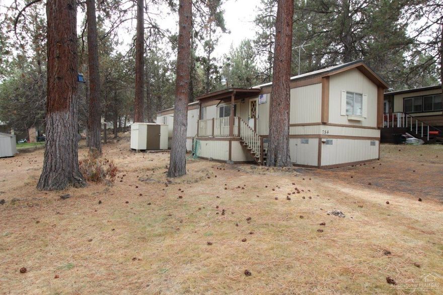 Awesome Low Price. Don't delay, won't last. On a quiet dead end street. Sold as is. Some TLC can make it very cute. All kitchen appliances included. Covered porch. Pellet Stove. Forced air heating. 2 full baths. Large storage shed. Community playground & lake. Clubhouse. Owner occupy only. No sublease. All occupants must have park approval / background check. Space Rent $675/month.