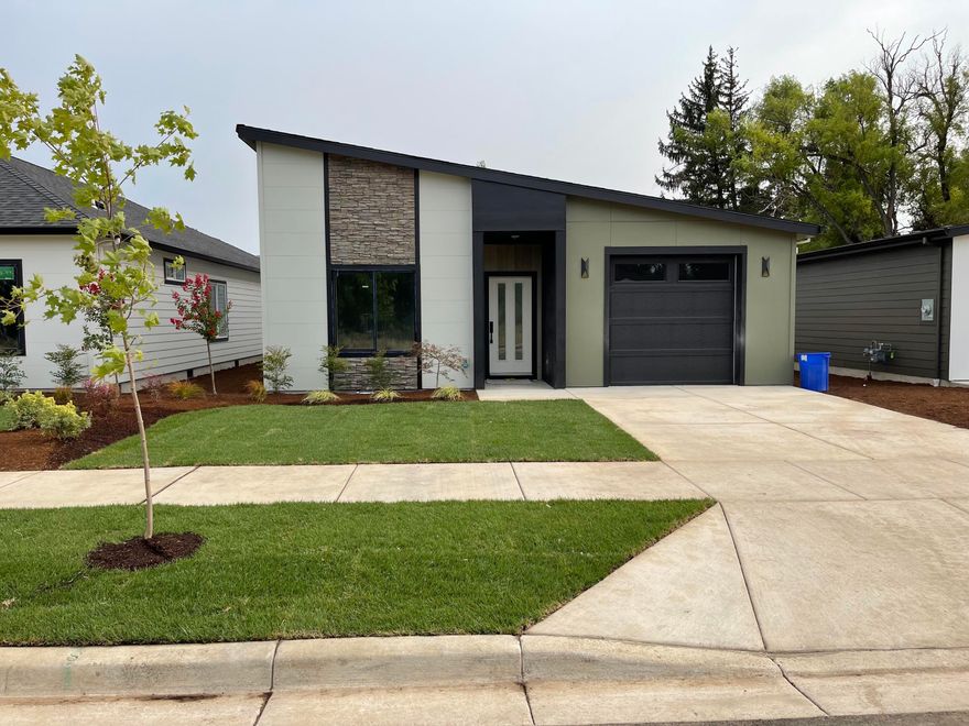 Meadows at Crooked Creek Phase 1--22 new homes conveniently located in the heart of Medford, with occupancy starting in early spring 2021.  This beautiful mid-century modern style detached single-story home by Rispoli Design & Build features 1,441 sq ft (per builder), 3 bedrooms and 2 full baths, and 100% Hardie cement non-combustible siding & trim exterior. The extensive list of features helps ensure quality & longevity, with vaulted and 9-ft ceilings, quartz countertops, tankless water heater (some plans), LVP flooring, baseboards, porcelain tile, kitchen island, s/s gas appliances w/convection oven, Diamond cabinets with soft-close doors & hidden hinges, fully finished & insulated extra-deep garage w/insulated garage door & wi-fi opener, vinyl fencing, professional landscaping, and much more! Seller Agent has an ownership interest in the LLC that owns the property. Certificate of Occupancy in hand; ready for immediate occupancy.