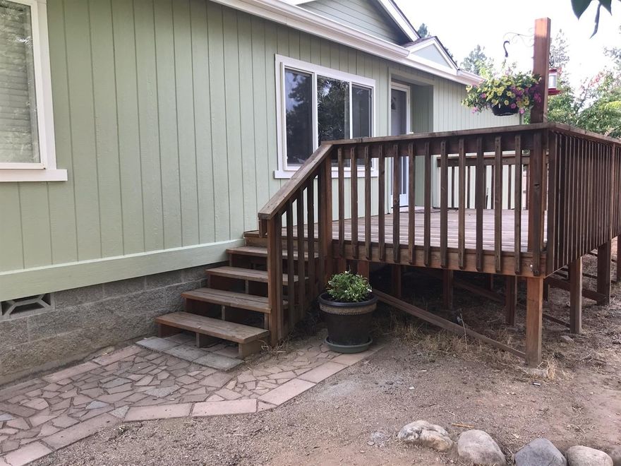 First time home buyers check this out! Move in ready home includes all the appliances. Recently remodeled manufactured home on a little over an acre. Located just before the covered bridge in Wimer, this home has vaulted ceilings and a certified wood stove as well as central air and heat. Vaulted ceilings, tile floors, new roof, new carpet, new pain interior and exterior, double-pane windows, split floor plan and a nice large deck great for enjoying the quiet outdoors. The property is flat and can be used for many things with plenty of room to park. There is a fenced garden area, a 24x36 shop / garage that is insulated and has 220 power and water. This type of property is hard to find in the Rogue River area. Schedule an appointment today.