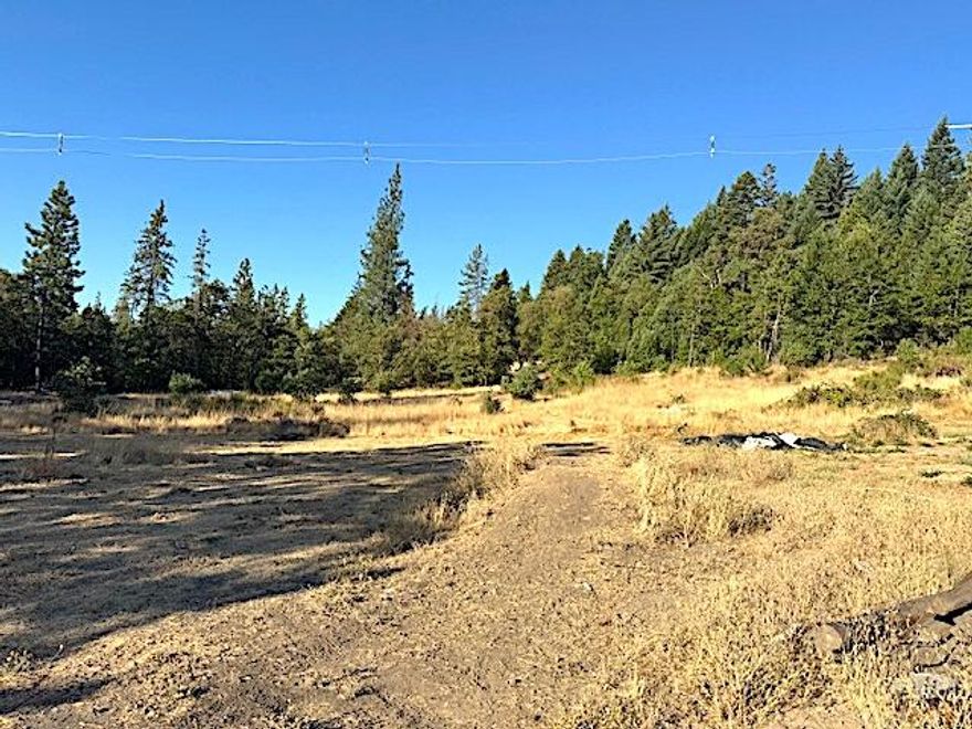 $35,000 Price Reduction - Very Motivated Seller. Just over 6.5 acres zoned RR-5 offering a ton of potential for your future home or investment. The property includes a 2-story, 4 bedroom, 1.5 bath home that needs a full remodel or rebuild, giving you the opportunity to design it exactly how you want. A newer septic system and a strong-producing well are already in place. Multiple outbuildings on the property provide space for storage or projects. There is also a small ADU-style cottage on site (permitting status is unknown; buyer to perform due diligence). With land, utilities, and improvements already established, this is a solid foundation to build on. Seller is motivated and ready for a smooth and quick sale.