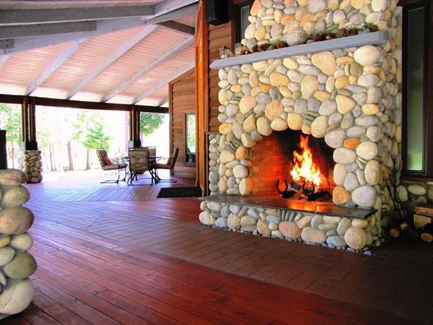 Stunning custom home on year around Munger Creek located in the Applegate/Williams Valley of southern Oregon. Views of the surrounding mountains, woods and pasture are truly breathtaking. The home has a southwestern flair with northwestern style. Craftsmanship & attention to detail are prevalent throughout. Massive covered porch surrounds the majority of the home and is constructed of beautiful reclaimed cedar. Interior floors include extensive tile, marble and rock & Counter tops are slab granite. The main level includes Master Suite, gourmet kitchen with full service Butlers pantry. Inside a fully fenced 3 acres is the 1100 plant Syrah organic vineyard and organic garden. 4 acres of pasture & all are irrigated by a 75 GPM Licensed well. The vineyard is currently maintained & managed under contract. The Guest House/Shop includes a heated greenhouse which allows for a 12 month growing season. 22x60 pole barn, 16x40 equip/shed and creek side gazebo. Abundant Wildlife! Really Awesome!!