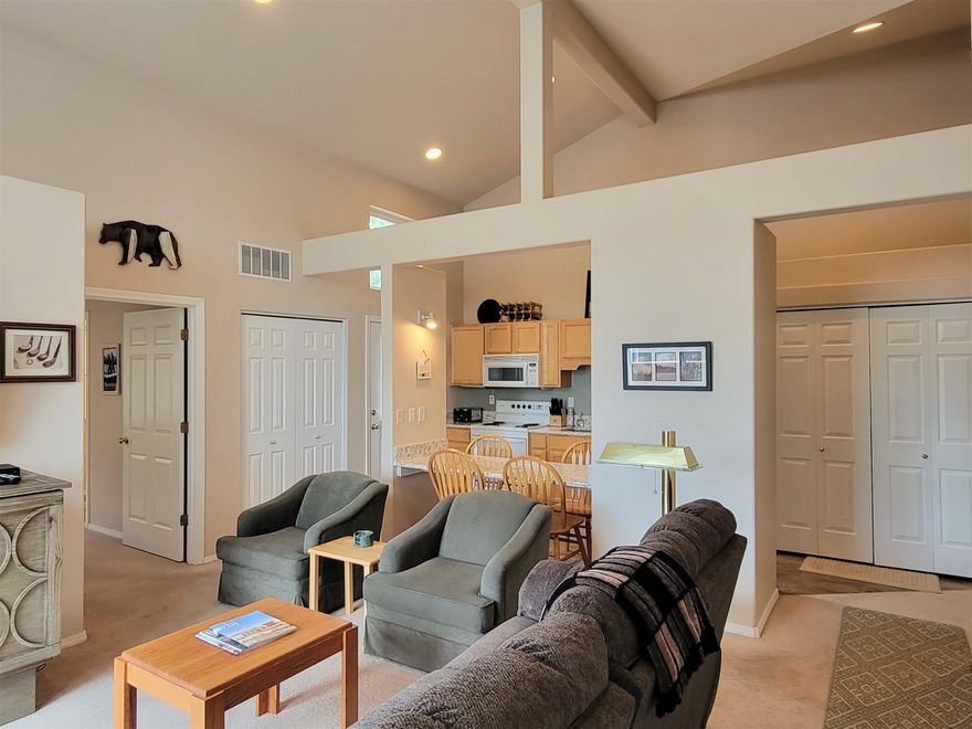 This upper-level condo has many upgrades, beautiful sunset views, and vaulted ceilings in nearly every room! Located in the Business Park, the Powder Village condos have a community pool and hot tub and close to Sunriver Village with all the resort restaurants, cafes, amenities. Deschutes River is also nearby for floating, kayaking, fishing, and Mt Bachelor and Cascade Lakes are just minutes away. With 2 beds, 2 full baths, and 940 sq ft, this condo is one of the largest units in Powder Village. It has an open floor plan, high vaulted ceilings throughout, spacious master suite, and large guest bedroom, bathroom. Upgrades include premier laminate flooring, quartz countertops, fixtures, furnishings. Murphy bed/cabinet bed in living room. Furnished per inventory list. In-unit washer/dryer. Front deck with great views and second deck with privacy and extra room to store gear. So close to all the amenities and recreation. Just hop on a walking/biking path and you're off to enjoy Sunriver!