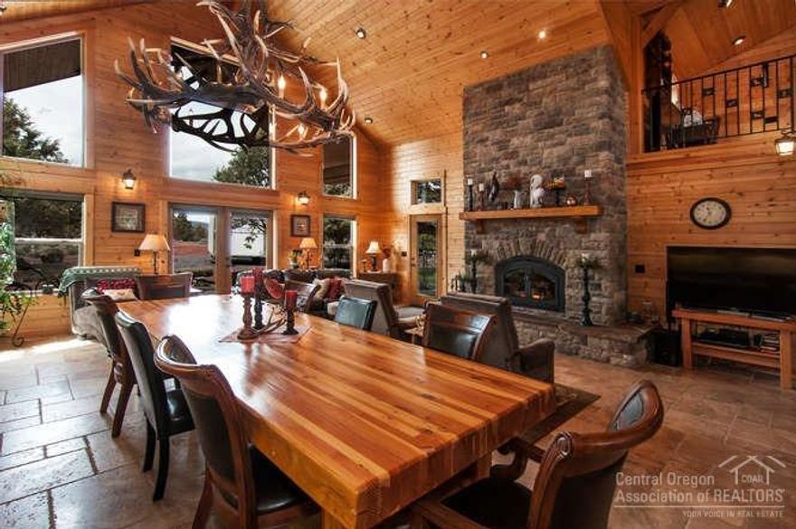 Enjoy gatherings in your grand NW lodge-inspired great room w/ towering vaults, natural light & mt. views. Custom addition is graced by rock floor-to-ceiling wood fireplace, loft, extensive built-ins, radiant heat & access to outdoor living. Gourmet kitchen will inspire your inner chef with an expansive island, walk-in pantry & spacious mud rm. 1st floor offers ensuite/2nd master w/ tile shower & 2 addtl bdrms. Upstairs features full living quarters w/ updated full kitchen & master suite. 24x36 3-bay shop.