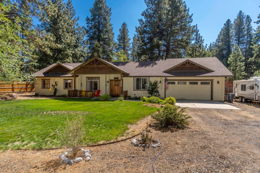 Custom built single-level home on the canal, on a half acre, pine-treed lot in Deschutes River Woods! Open floor plan with vaulted ceilings, gas fireplace, laminate floors and big windows that are perfect for entertaining. Kitchen has granite countertops, stainless steel appliances and tile backsplash. Great separation from the master and guest bedrooms. Master bedroom has a walk-in closet, spacious bathroom with heated tile floors, double vanity sinks, bidet, soaking tub and tiled shower. Soak up the sun on the large, south-facing back deck and listen to the water float by.  Spacious, fenced and landscaped back yard with added storage shed. Double car garage with separate small wood shop or storage room behind. Additional large, landscaped front yard has plenty of room to park an RV and toys. This is the perfect Bend oasis!