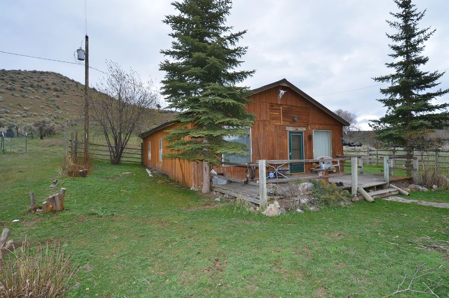 Weekend Getaway/Hunters Cabin. Here is 5.12 acres in Hereford that has a 1940's cabin with power. 992 sq ft, 2 bedrooms, 1 bathroom that is waiting for you to make it your own. 2 tax lots, 4.57 acres, fenced, dry pasture with animal shelter and .55 acres with cabin, dry field and shed. Hereford is located 10 miles from Unity Lake and minutes from BLM. No foundation. Cash only. Being sold as is. Buyer to do due diligence.