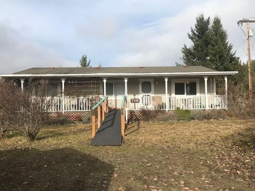 Very pleasant property set up for relaxing and peaceful rural country living. This property has 5 acres of level usable land. The house has 2 bedrooms and 2 bathrooms; it is in a very good condition due to the excellent care and maintenance regularly carried out by the owners. It has a pleasing porch and deck in the front for unwinding while contemplating the surrounding beautiful pastures and mountain views. It also has a deck in the back. The master bedroom has the convenience of special masterfully handcrafted bookshelves and cabinets. The well, which produces very clean and tasty water, is rated at 14 GPM according to the records. There is also a lovely beautiful garden in the back yard, and a large 28'x24' well-insulated shop with 220-Volt power and an 8'x10' outdoor shed. There are two metal carports; one of them can accommodate 2 cars; the other one, good for RV parking, has full hook ups. You have to come and see it, to really appreciate it!