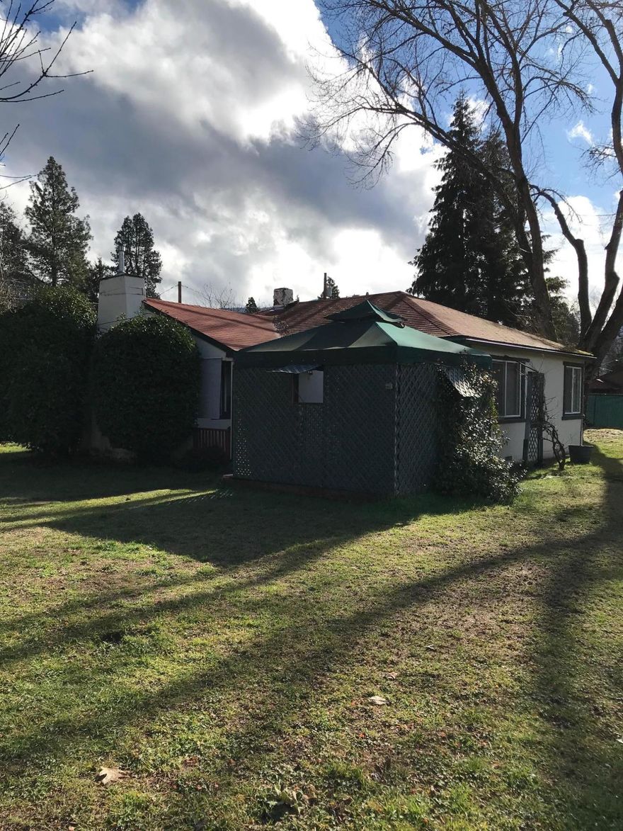 Come see this charming Spanish-style 2 bdrm, 1 bath home sitting on a .22 of an acre with a fully fenced large private yard, great for pets and kids!  Well-maintained newly painted interior with original hardwood floors, a gas fireplace insert, new appliances and new HVAC system with wireless security system & 4 cameras.  The detached single car garage includes a half bath and there is also a nice storage shed on the property. As a bonus, there is a gazebo in the yard for your outdoor enjoyment while viewing an abundance of mature plants and trees.  Don't let this one get away!!