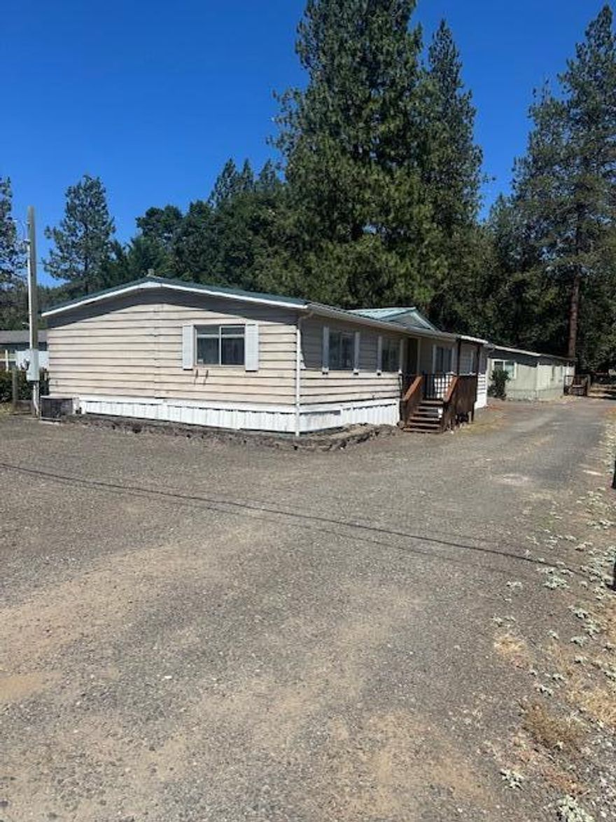 Rare opportunity to own two manufactured homes on one tax lot—ideal for multi-family living or investment! Live in one and rent the other to help offset your mortgage. Both homes offer 3 bedrooms and 2 baths; the front unit is 1,848 sq. ft., the rear 1,728 sq. ft. Both homes are vacant and move-in ready with fresh paint and new flooring in the front unit. Back home has a new roof put on in the last year. The HVAC unit was replaced recently in the front unit Homes share a well and are conveniently located near shopping and schools. Don't miss this unique, income-producing property—schedule your showing today!