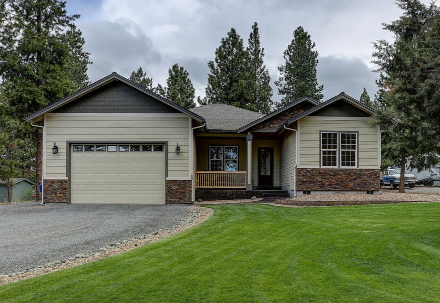 Gorgeous Home & Shop in S.W. Bend on an Acre! Come fall in love with this ''like-new'' NW Craftsman styled 2660sf, 4Bd/2.5Ba home built in 2014 featuring: stone fascia, big stamped concrete front porch, huge Great Room w/10 foot ceilings, knotty-Hickory HW flooring, cert-wood stove w/floor-ceiling stone hearth, open dining/kitchen w/solar-tubes, slab granite counters w/tile backsplash, granite B-Bar/Island, SS appliances, walk-in pantry & Knotty-Hickory cabinets, spacious Master Suite w/sitting area & private bathroom w/heated tile floor, dbl granite vanity, granite soaking tub + tiled shower stall & walk-in closet, laundry/mud room w/tiled floor & wash basin, attached extra-deep 2-car garage w/10' door, Electric FA Heating & Central AC, 10' ceilings throughout, HW recirculating pump + 2-HW heaters, landscaped beautifully front & back w/large back stamped covered-concrete patio & Hot Tub + fire pit! Detached 40x40 RV Garage/Shop w/1-14', 1-12' & 1-10' door (all 12' wide) + a 12' wing!