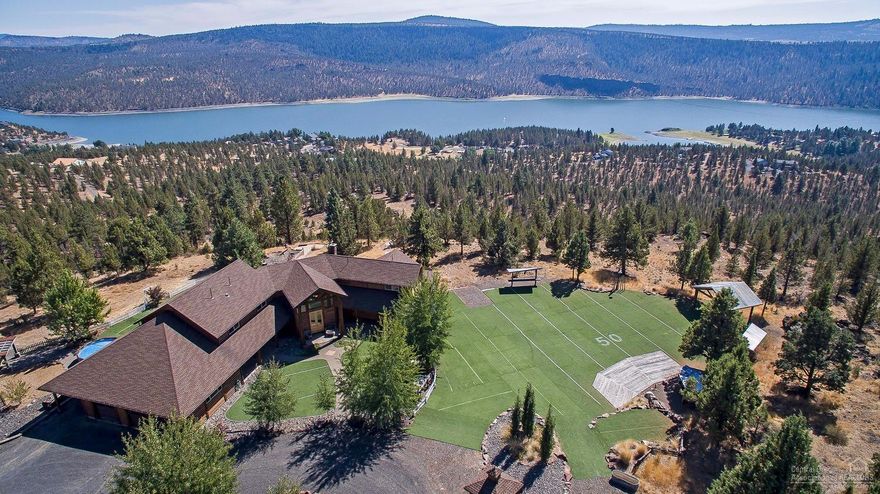 Million dollar views with a home to match. This beautiful custom contemporary log home sits on 96.06 acres at the top of Rocky Top Rd. and has an unmatched view of Ochoco Reservoir, along with an equal stunning view of the rim rock landscape to the other side of the property. Attention to detail at every turn in this 5993sf paradise W/ 5br, 3.5ba; bonus room, game room and wet bar. The outside grounds include a Venue that has 2 custom built bars, a DJ area and a dance floor and a barn. Too much to list.