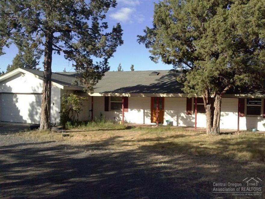 Single level 3 bed 2.5 bath with large bonus/office. Property consists of 2 barn/stables with electricity and no frost spigots. Property consists of 11 stalls, turn out pens, and tack room. Home sits on 2.75 acres and has 1 acre irrigation with pond. Covered RV parking with waste dump and electric hook up. Plenty of elbow room just minutes from town. Must See.