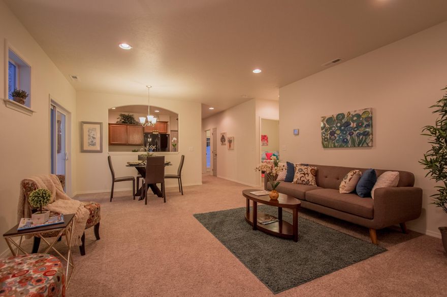 The Canyon makes every bit of its 1201 square feet count, offering great comfort in a modestly sized single level plan. The spacious living room adjoins the dining room, and the efficiently-planned kitchen boasts ample counter space and cupboard storage. An expansive master suite features a dual vanity bathroom and a generous closet. The other two sizeable bedrooms - one of which may be converted into an optional den - boast large closets and share the second bathroom. It's no surprise this home is as popular as ever.