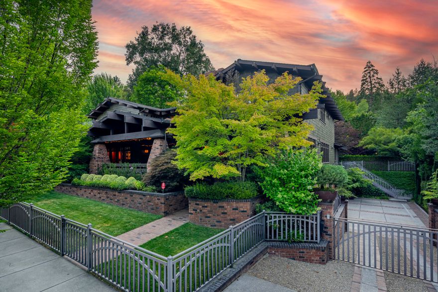 Exceptionally refined Craftsman home with unparalleled amenities - just steps from Lithia Park, and three blocks from Ashland's downtown plaza. Solid wide-plank eucalyptus floors, fir-paneled walls and ceilings, meticulous tilework, designer lighting, remote-operated shades, integrated speakers and entertainment systems, wood-burning fireplaces, and intimate gathering spaces throughout. Tranquil main-level primary with two full ensuite bathrooms, gourmet kitchen with stainless Viking appliances, butler's pantry, spacious formal and informal dining, three guest bedrooms with full ensuite bathrooms, professional-grade spa with massage shower and infrared sauna, in-home theatre with seating for twelve, game room, temperature-controlled guitar vault, two offices, and elevator serving all three levels. Mature landscaping with ornamental trees and plantings, serene outdoor living areas with radiant-heated patios and pathways, plus an in-ground lagoon pool with hot tub. Inquire for details!