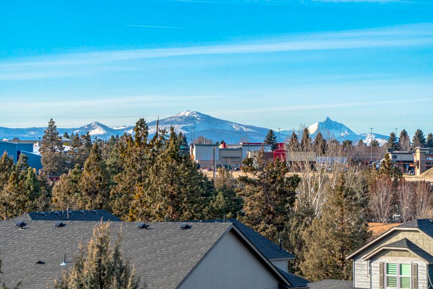 Another Southcrest beauty perched on a rock outcropping allowing for great territorial and Cascade Mountain views from almost every room in the house.
This 1716 sq ft, 3 bedroom, 3 bath home has an easy living feel. The great room is where you'll most likely be spending most of your time. Windows abound with a granite slab kitchen which opens to the living area featuring a corner fireplace, and those Cascade Mountain views! Generous sized bedrooms and a fabulous main suite with walk-in closet upstairs for added privacy. Just a couple minutes from the Parkway, allowing easy access to all that Bend and the surrounding area has to offer.