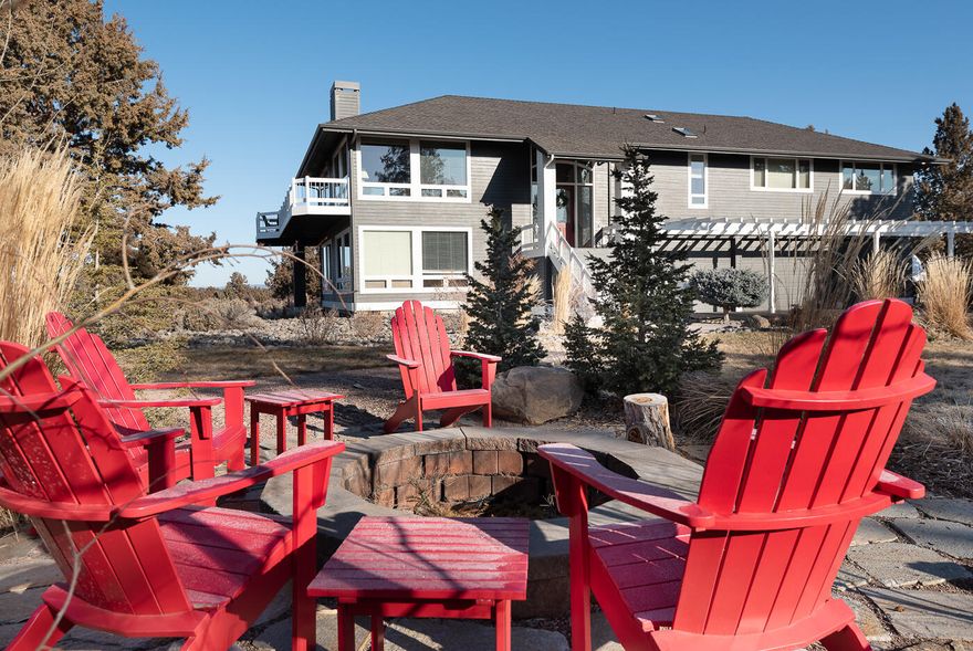 Breathtaking 10 peak Cascade Mountain views from this excellently maintained home on 9.96 acres. Beautiful landscaped grounds with great sized fire pit, large playground with play structure, bike pump track coupled with worry free natural landscape. Reverse living allows for stunning views from the great room, kitchen and dinning room. Kitchen newly updated with quartz counters and stainless steal appliances. Extra large primary suite with walk-in closet, jetted soaking tub, and walk-in shower. Large wrap around deck includes newer hot tub. Home has been recently painted. Additional buildings on property include 700+ ft studio/guest home with one bedroom, private bath and 900+ ft insulated and heated shop. Entire parcel is field fenced. Paved road and driveway, gated entry. Located between Bend and Sisters. Move-in ready condition.