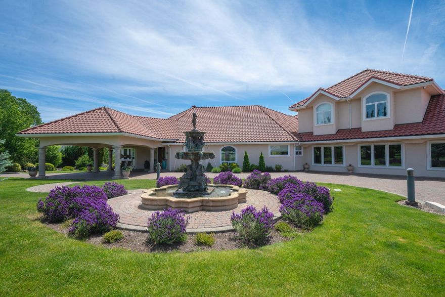 Experience this one of a kind estate! It has 40 irrigated acres with a 3 acre lake. The property has water rights. The landscape is professionally designed. The main house has 4 beds and 4.5 baths. There are 18 foot ceilings with large windows offering incredible views. The media room has a full bar. Upstairs has 3 bedrooms, 2 bathrooms, a kitchen and laundry. The travertine floors are heated. The attached garage has 7 stalls. The basement houses all of the systems, a 1200 bottle wine cellar and a walk-in safe. The French doors lead to the outdoor kitchen, saltwater pool and jacuzzi. The path takes you to an out building with a wet and dry sauna and lighted tennis court.  The detached shop is 50' by 70' with 5 twelve foot garage doors. Above the shop is an office and a 2 bedroom 1 bath unit. There is a 500 gallon underground propane tank.The well produces 30 + gallons p/min. There's a 48KW propane generator. There is an easement that allows access to the Rogue river.