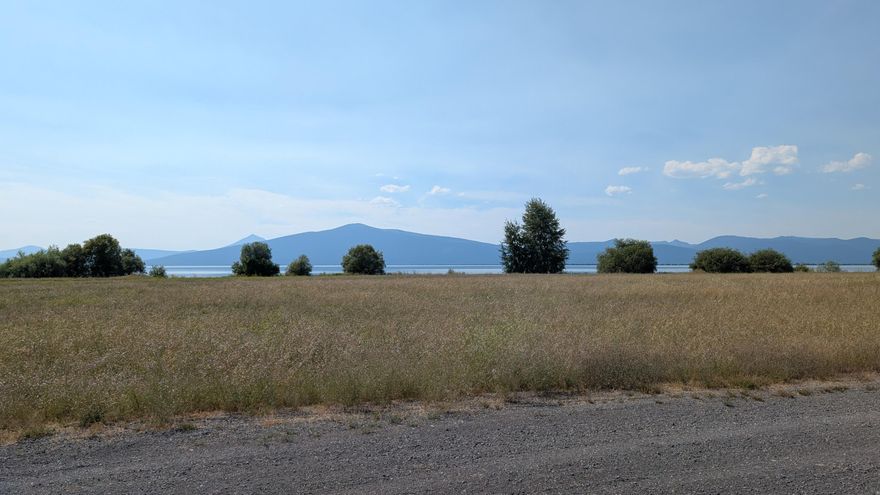 This one acre lot is beautifully level and ready for your dream build. Gorgeous views of the lake and mountains in a gated community. Close to wonderful walking/birding/hiking trails, a boat ramp, golf course, and plenty of other activities. This community is perfect for both a permanent residence or a vacation home, all your dreams could come true here! Owner is an Oregon licensed Realtor.