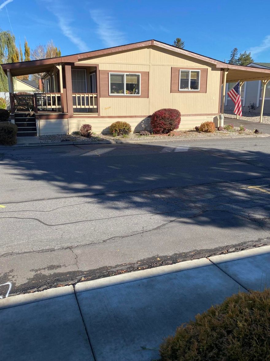 Great 55+ park. 2 bedroom 2 bath Marlette Manufactured home. Very nice front porch, and also a carport with 2 sheds