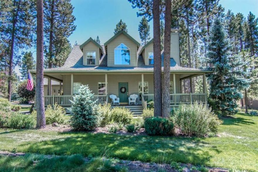 This charming well maintained home with wrap around porch is ideally located on a spacious, beautifully landscaped corner lot. Cozy wood-burning fireplace in the living room, hardwood floors in living, kitchen & dining areas. Spacious kitchen with tile center isle, breakfast bar & nook with bay window. Main level master suite w/gas fireplace, separate tub & shower, marble tile floor. Upstairs bedrooms w/dormers, built in bunk beds. Bonus room with vaulted wood ceiling & gas stove. Private deck with hot tub.