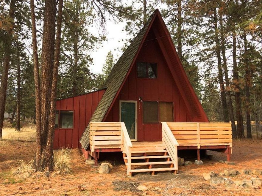 Charming cabin in the woods on a .57 acre lot with a new front deck. Plenty of room for a garden. This cozy A frame has newer kitchen cabinets, a master on the main level and lots of charm. Beautiful new carpet in the living room and bedroom, plus new VCT tiles in the kitchen and bathrooms. This cozy home is move in ready! A new certified wood burning stove has been installed.