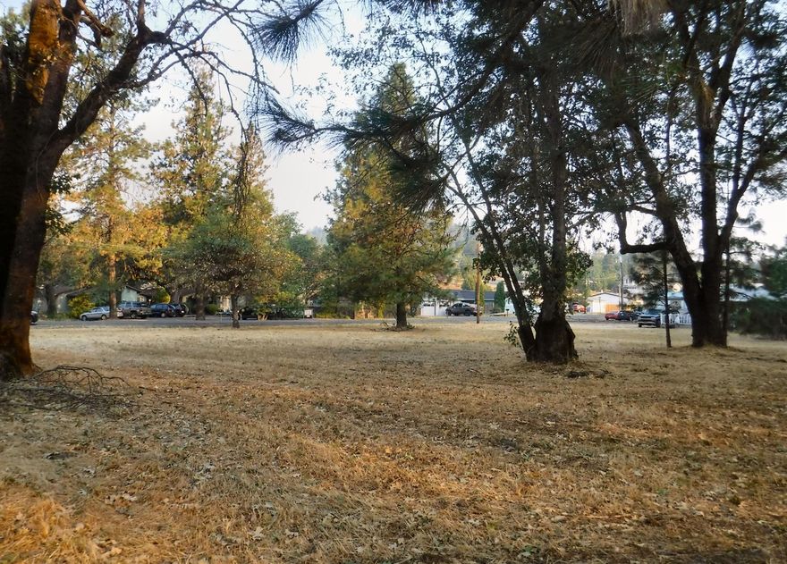 2.03-Acres zoned R3, mutli-family, all flat useable land. 3-Tax lots, city sewer, well, community water available. Shady Cove needs rental units, build them here!