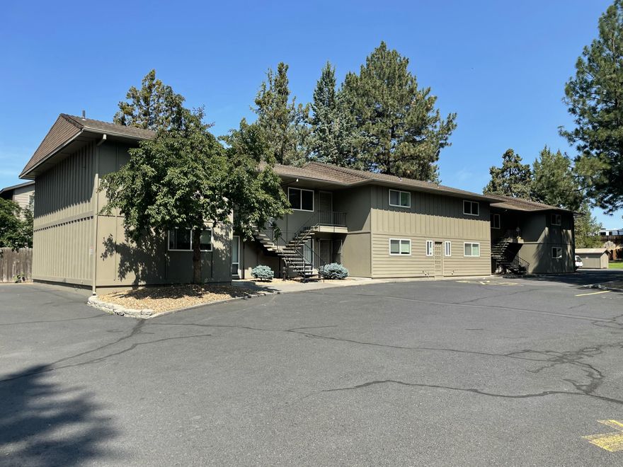 Back on market with great new price. Studio Garden Apartments.  Iconic Bend, Oregon apartment homes located in the heart of the community.   First time ever on the market.  Family developed, owned, and managed since the 1970's.
22 garden style units on 2.82 acres in a beautiful, wooded setting with seasonal canal running through.   3 two story buildings containing 10 one bed one bath apartments and 12 two bed one bath apartments. Plus two laundry rooms with storage units.
 Extremely well managed and maintained.  Always fully occupied.
And best of all, over an acre of developable property all zoned RM for multifamily housing.