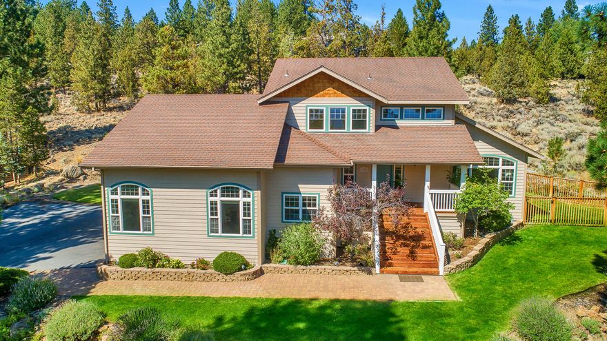 This beautiful Aubrey Butte home is nestled on a private and sunny half acre lot in the City View neighborhood.  Built in 1997, this nearly 2500 square foot home is perched for capturing the natural sunlight.  Main level with solid maple flooring, formal and informal living areas and primary suite. The kitchen has been modernized with slab countertops and updated appliances. The second level has three bedrooms, a large bathroom, and a potential pass-through addition above the garage to add a future bonus room.  Take in the sunset and city lights from the large front porch, or relax in the shade on the back deck off the kitchen. 800 square foot two-car garage with large shop area. New furnace in 2018.  Mature low-maintenance landscaping around the home as well as wide open areas with gorgeous rock outcroppings.  Just minutes to downtown Bend!